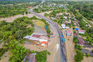 Wall Mural - High-angle view of the Great Flood, Meng District, Thailand, on October 3, 2022, is a photograph from real flooding. With a slight color adjustment
