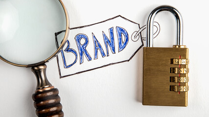 Wall Mural - brand. magnifying glass and padlock on white background