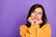 © deagreez - Closeup photo of young adorable girlish pretty woman wear orange sweater touch cheeks dreamy interested look empty space isolated on violet color background