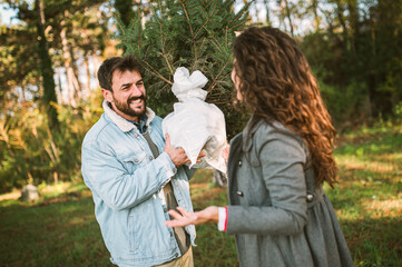 Young happy couple is preparing for the New Year holidays