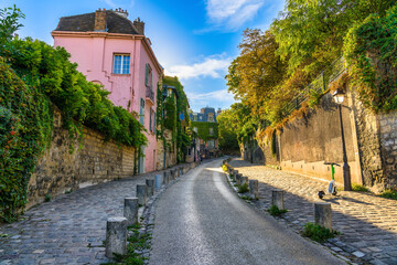 Canvas Print - View of old street in quarter Montmartre in Paris, France. Cozy cityscape of Paris. Architecture and landmarks of Paris