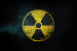 Fototapeta  - Nuclear energy radioactive round yellow symbol on asphalt texture