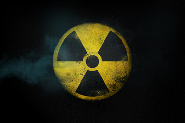 Wall Mural - Nuclear energy radioactive round yellow symbol on asphalt texture
