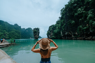 Asian traveler woman joy relaxing in beautiful destination island, Phang-Nga bay, Adventure lifestyle travel Thailand, Tourism nature landscape , Tourist on vacation trips