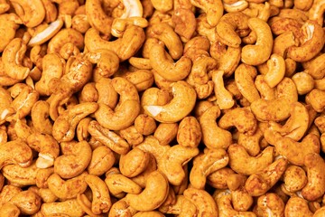 Wall Mural - Top view closeup of tasty salted, pan-fried cashew nuts with pepper flavor