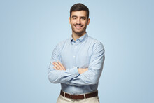 Handsome Smiling Business Man In Blue Shirt Standing With Crossed Arms On Blue Background