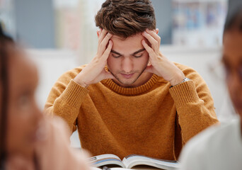 Poster - Study, stress and student at university with anxiety for a test. Young man with headache, worried and studying with textbook on desk in library. Tired in education, learning and stressed about exam