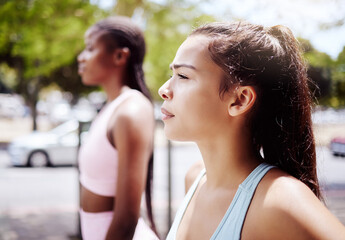 Canvas Print - Fitness woman, focus and friends for workout, exercise and running marathon with mindset in urban city outdoor. Thinking athlete, runner and young sports person ready start healthy cardio challenge