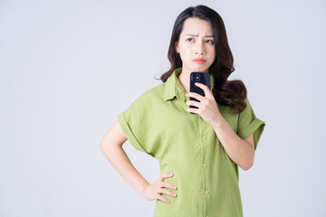 Wall Mural - Portrait of young Asian woman on background