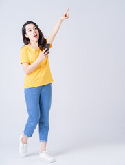 Wall Mural - Full length photo of young Asian woman standing on white background