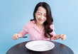 © Timeimage - Young Asian woman eating, eat concept