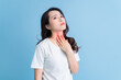Young Asian woman has a sore throat.