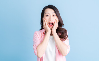 Portrait of young Asian woman on background