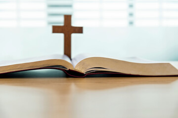 Wall Mural - Wooden cross and bible book on the table