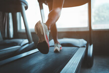 Close Up Of Feet, Sportman Runner Running On Treadmill In Fitness Club. Cardio Workout. Healthy Lifestyle, Guy Training In Gym. Sport Running Concept