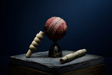 Fototapeta Zwierzęta - Cricket ball and bails still life in moody light with a blue background