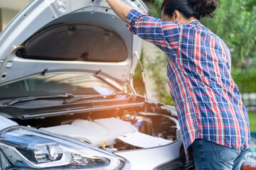 Open hood mechanic engine system to check and repair damage car crash.