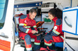© zinkevych - Paramedical professionals sitting in the medical emergency vehicle