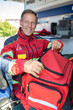 © zinkevych - Cheerful paramedic preparing for a medical emergency call