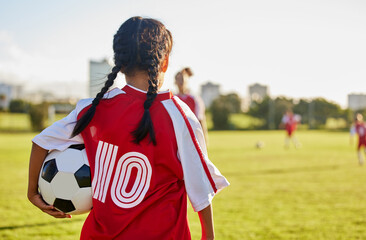 Canvas Print - Children, sport and football with a girl soccer player on a field outdoor for fitness, exercise or training. Sports, workout and kids with a female child on grass for health, wellness and recreation