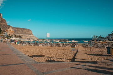 Beach in Canary Islands with rental loungers