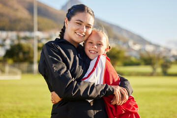 Sticker - Football coach, child and hug during sports training on outdoor field for soccer while showing support and motivation for match. Portrait of girl kid or junior player and her woman trainer in russia