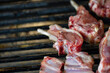 © vigenmnoyan - Closeup of grilling pork ribs, homemade barbecue.