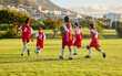 © N Lawrenson/peopleimages.com - Girl, soccer and fitness team in field sports playing fun game together in training for competition outdoors. Group of female football players in teamwork sport match for health and exercise outside