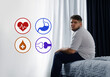 © New Africa - Virtual icons demonstrating different health problems and overweight man on bed at home