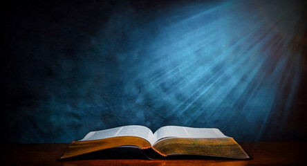 Open old book on wooden table, BIBLE