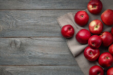 Red Ripe Apples Are Scattered On A Wooden Background From Old Boards, Apple Harvest, Free Space