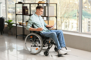 Sticker - Young man with physical disability working in office