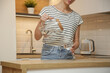 © triocean - Young woman pouring water from jug in the drinking glass