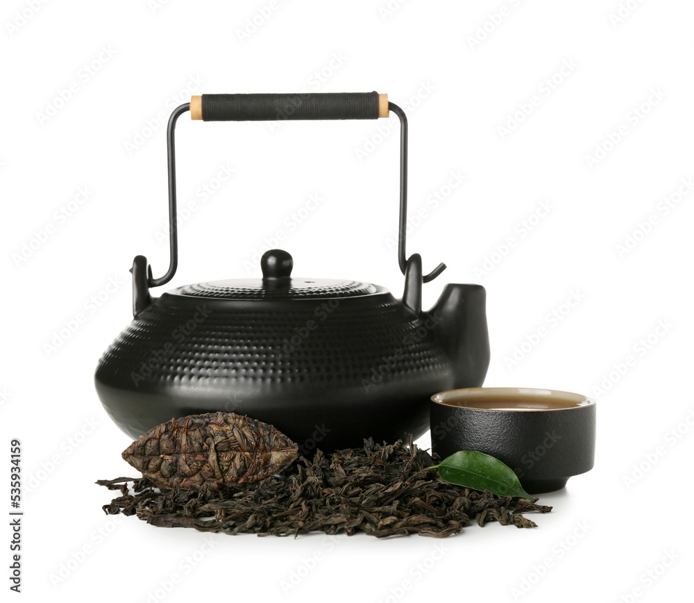 Dry puer tea with cup and teapot on white background