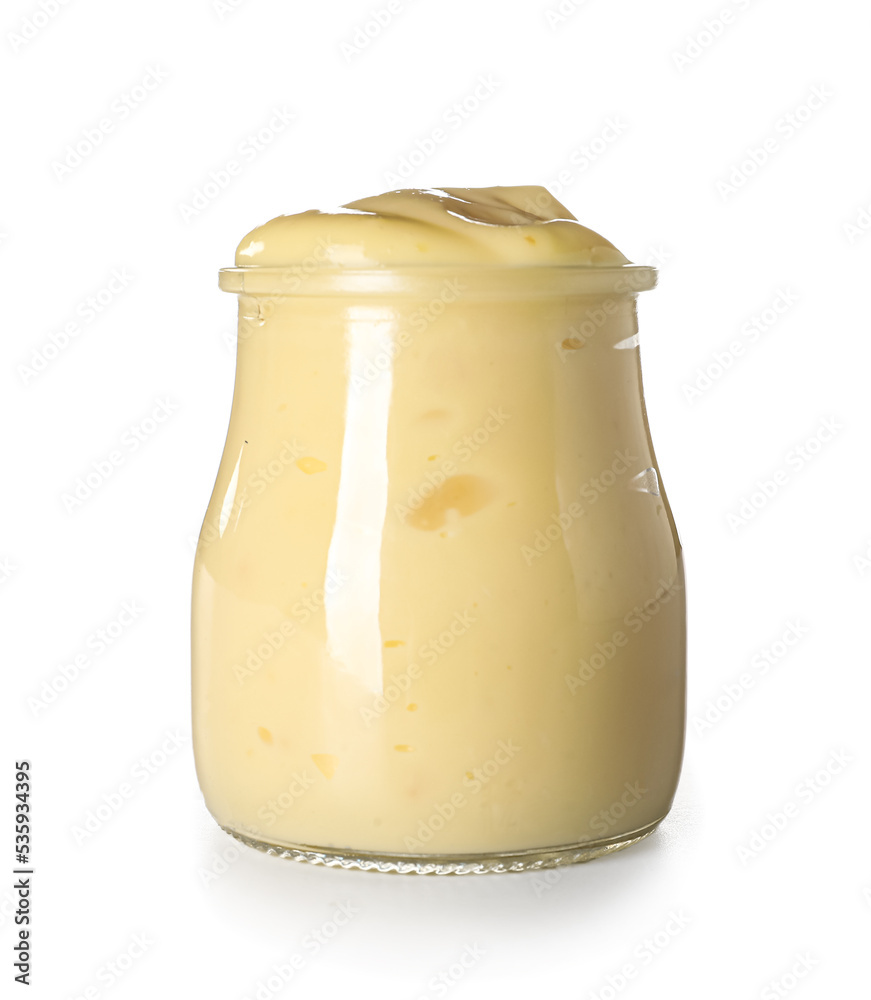 Jar of tasty vanilla pudding isolated on white background