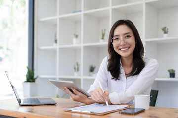 Wall Mural - Smart asian business woman smiling at office space. real estate, lawyer, non-profit, marketing