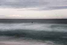 Lone Surfer In The Water Long Exposure