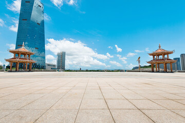 Canvas Print - Empty square and city buildings