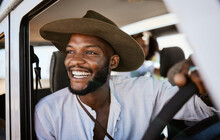 Happy, Taxi And Driver With Black Man Driving And Enjoying Career, Safari Tour Guide In Vehicle. Adventure, Travel And Smile African American Looking Excited While Touring With Passenger, Carefree