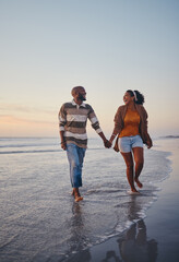 Canvas Print - Travel, beach and couple walking in the sea, laughing and bonding on an ocean trip. Freedom, love and romance with black woman and man enjoy conversation and funny joke while holding hands in water