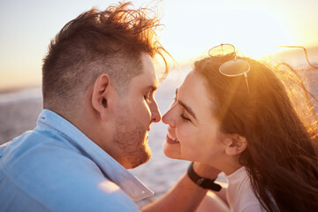 Beach, smile and face of couple with embrace on holiday by the sea and nature travel in Greece in summer. Happy and love man and woman at the ocean during sunset with affection on vacation together