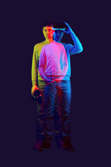 Wall Mural - man is using virtual reality headset. image with double color exposure effect.