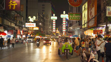 Night Market At Yaowarat Road, Bangkok City, Thailand. The Famous Tourist Attraction With Full Of Advertising Chinese Signs. Cars Of Tourists People With Billboard. China Town. Walking Street.