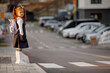 © Ruslan Ivantsov - schoolgirl crosses the road at a pedestrian crossing