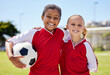 © N Lawrenson/peopleimages.com - Portrait of girls on field, sports and soccer player, smiling with teammate. Soccer ball, football and young kids having fun on summer day before match or game. Team, friends and teamwork in sport