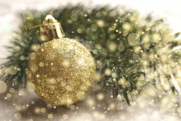 Wall Mural - Christmas background with christmas tree branch and golden christmas ball, Selective focus, golden snowflakes