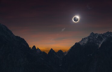 Poster - Total solar eclipse over high mountains, amazing dark mysterious scientific image