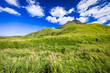 Dramatic view of high mountains and green field under the blue sky, Mt. Yufudake in Oita Prefecture in Japan, Travel or outdoor background