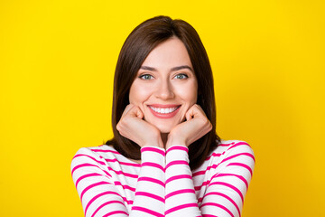 Wall Mural - closeup photo of young attractive positive woman hold hands head showing smile isolated on yellow co