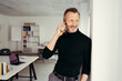 © contrastwerkstatt - Smiling mature businessman talking on cell phone